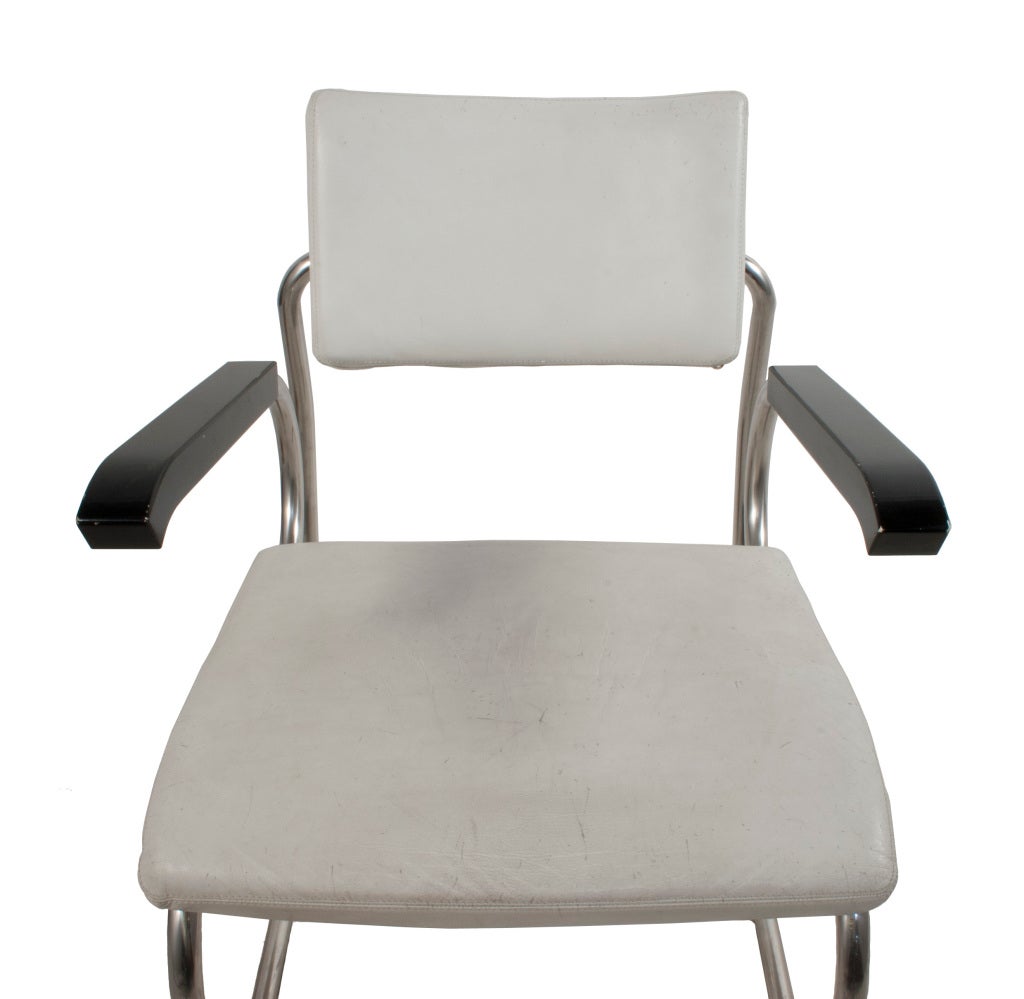 Steel, wood and white leather Armchair by Zanotta.