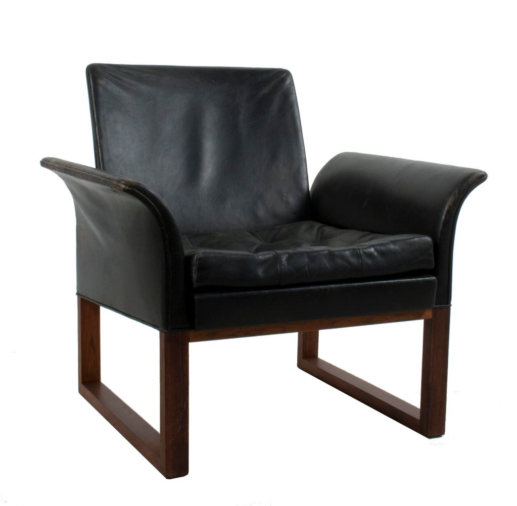 Black leather and rosewood Lounge Chair by Kindt Larsen and Thorald Madsen.