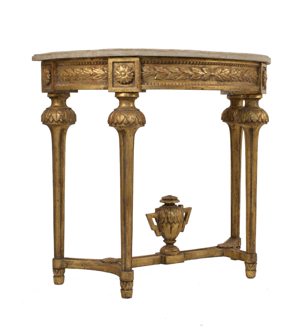 Gustavian console with a worn gilded and grey patina.