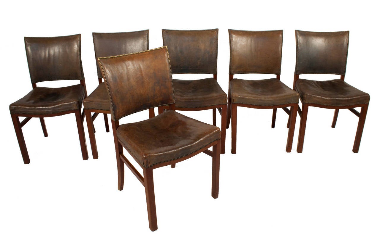 Set of six Side Chairs in the style of Fritz Hansen in leather and mahogany.