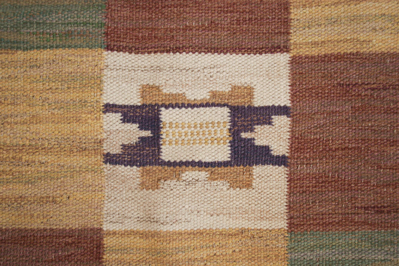 Vintage Swedish flat-weave, wool rug, signed MMF (Marta Maas-Fjetterström), in a soft colorful checkered pattern.