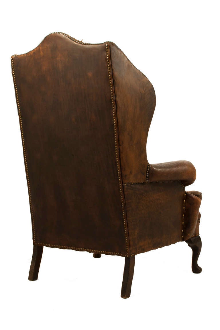 Pair of Leather Wingback Chairs with Stools 1