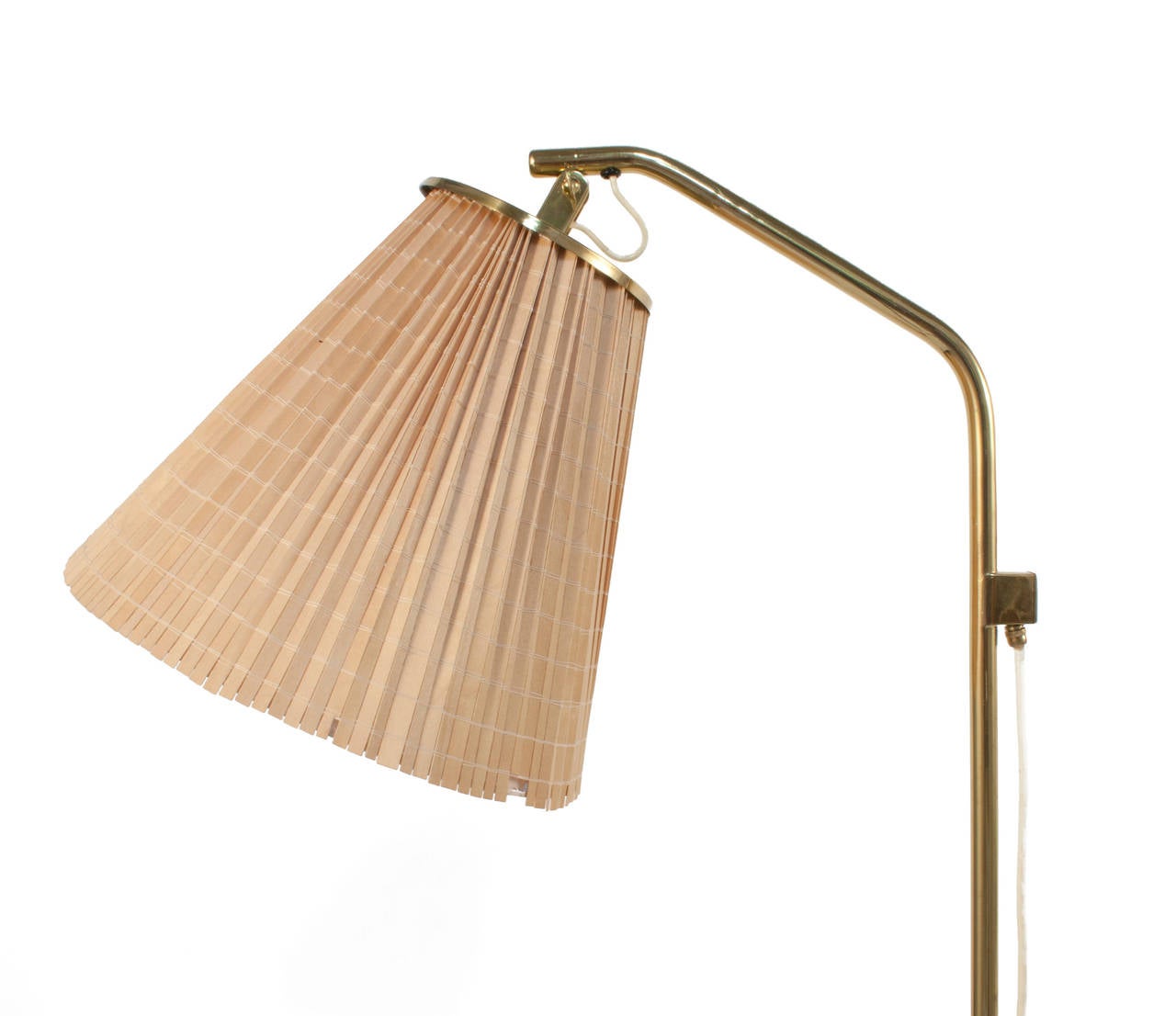 Floor lamp in brass by Paavo Tynell.