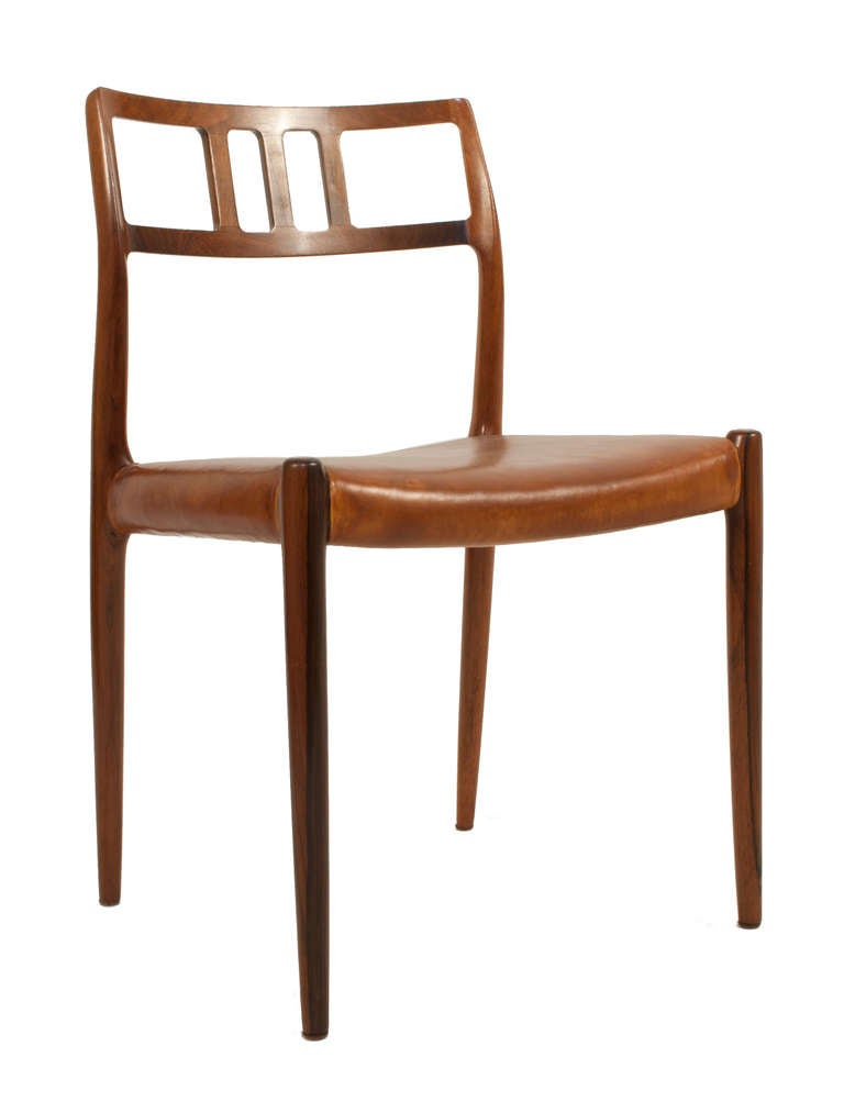 Set of eight leather and rosewood open back Dining Chairs by Niels Moller.