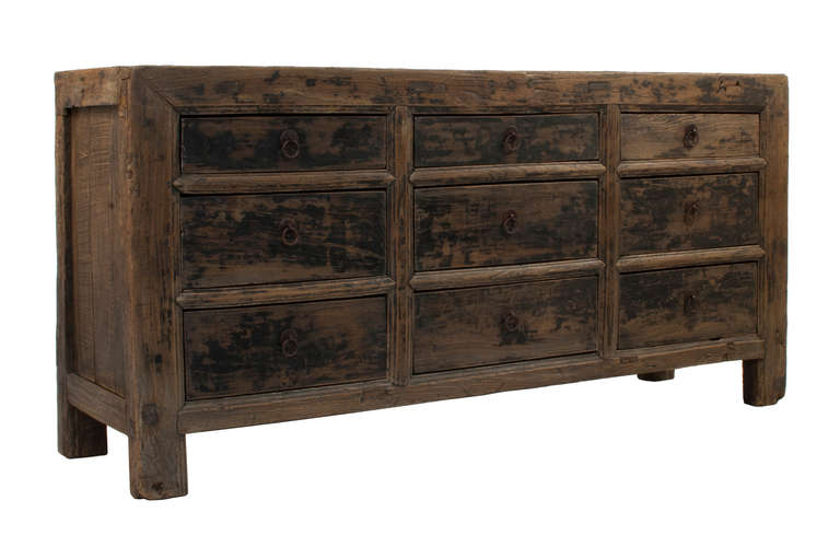 Sideboard with 9 drawers in elm wood.