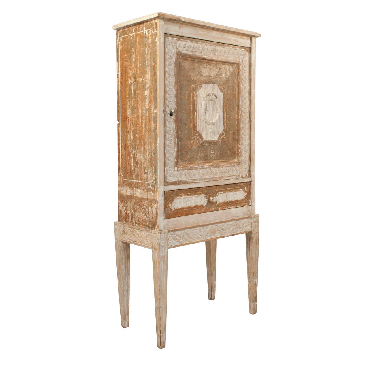 Small Gustavian cabinet with a door and a drawer in a worn patina of green, grey and salmon.