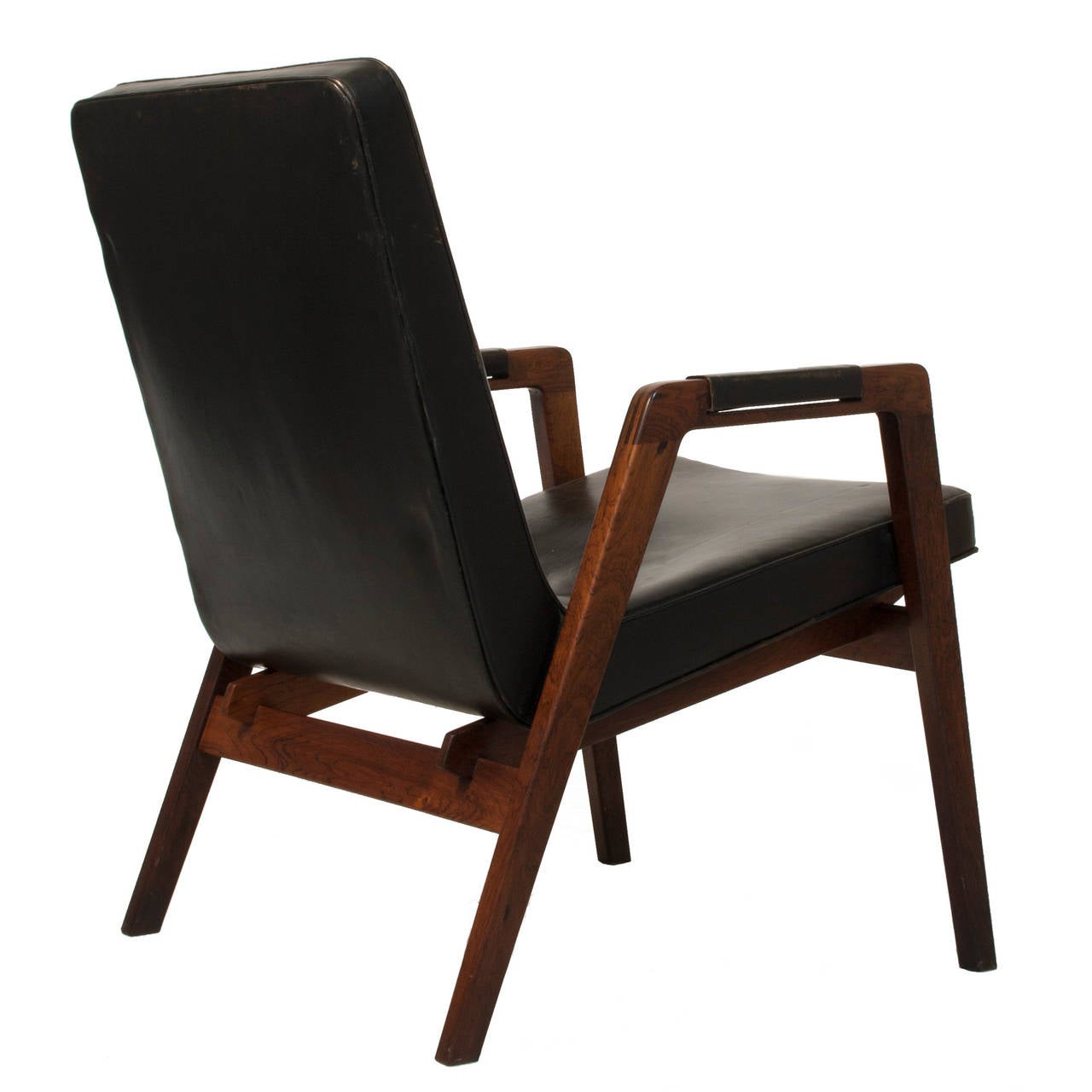 Black leather and rosewood lounge chair by Helge Brandt.