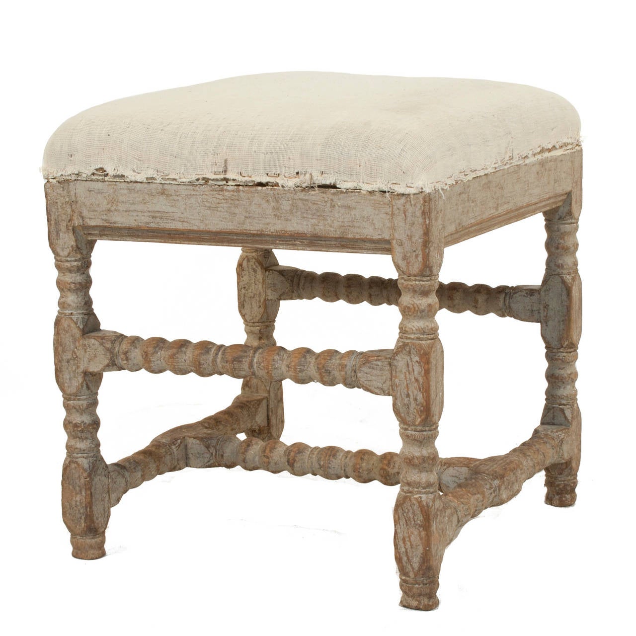 Pair of Baroque stools in a worn grey patina.