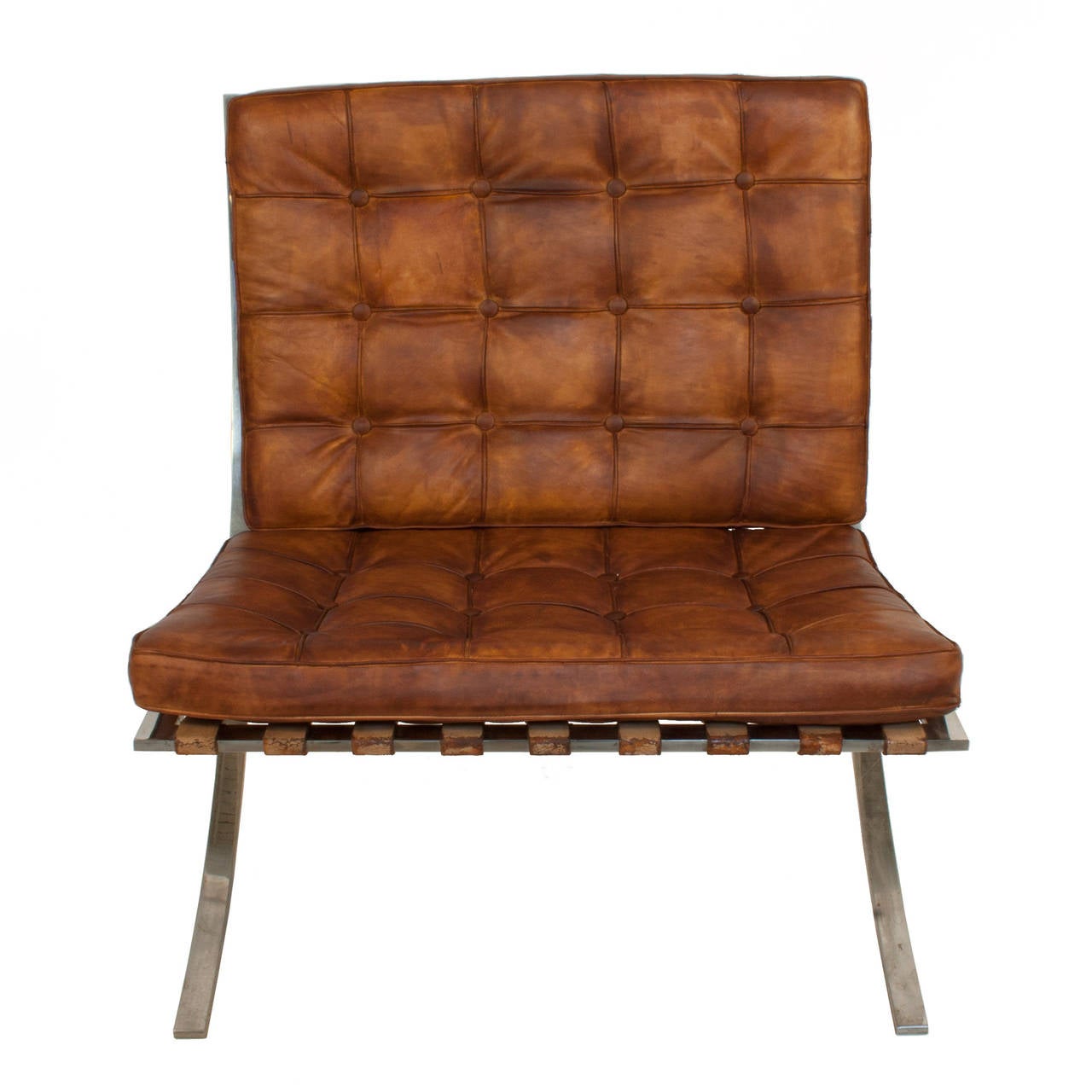 Barcelona chair by Ludwig Mies van der Rohe. Leather cushions have been upholstered at a time after the chair was made.