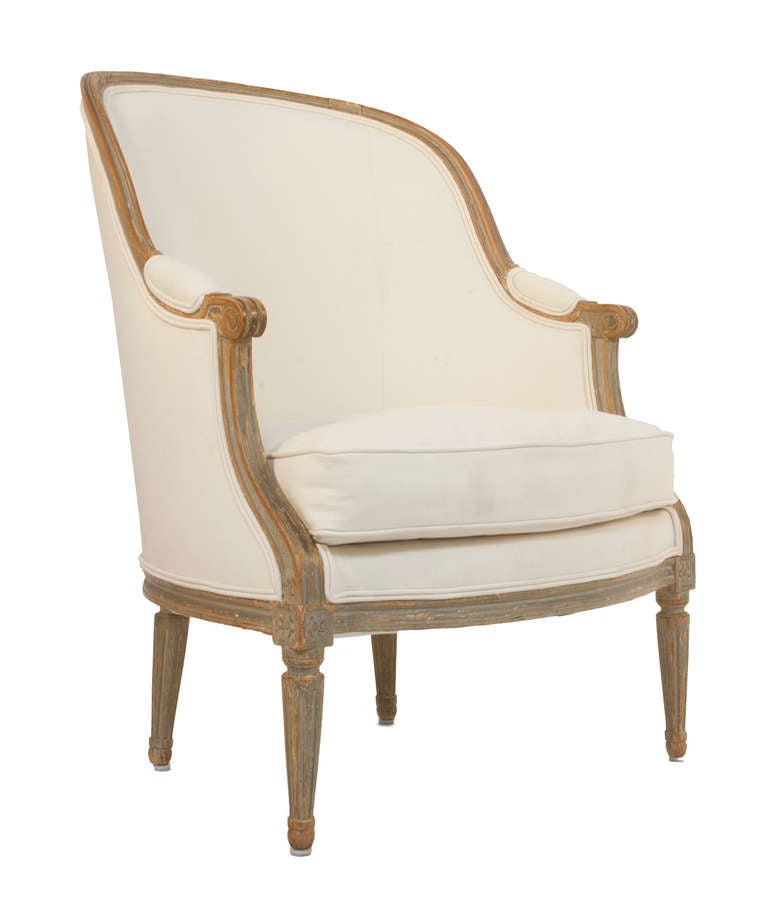 Gustavian bergere in a worn grey or green patina.