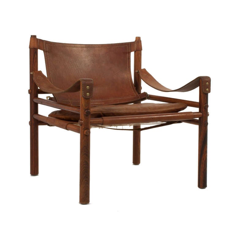 Pair of Arne Norell Sciroco Chairs in leather and rosewood.