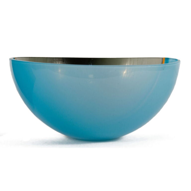 Glass Bowl with a yellow line seperating a light blue and a dark grey half sphere.