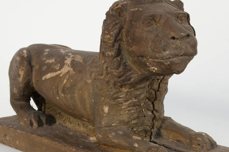 Pair of carved wooden lion sculptures from circa 1600.