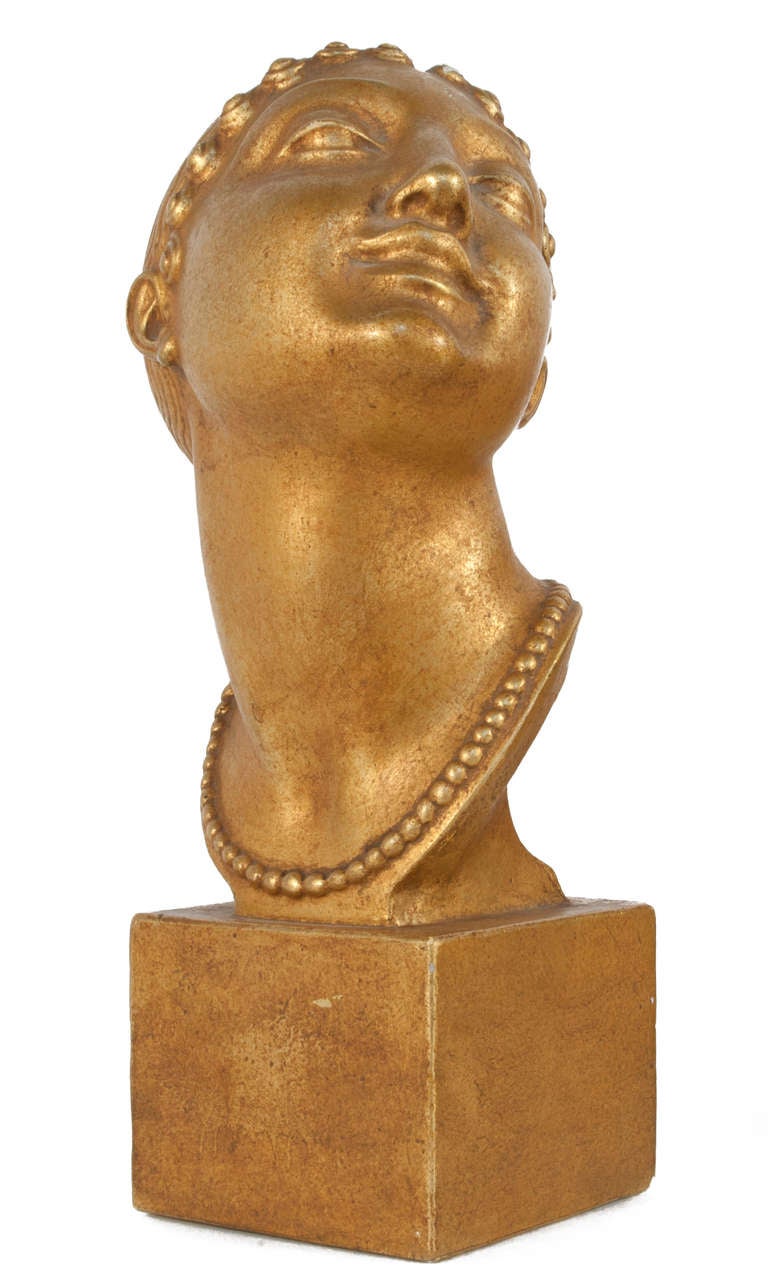Golden bust in plaster by Olof Ahlberg (1876-1956).