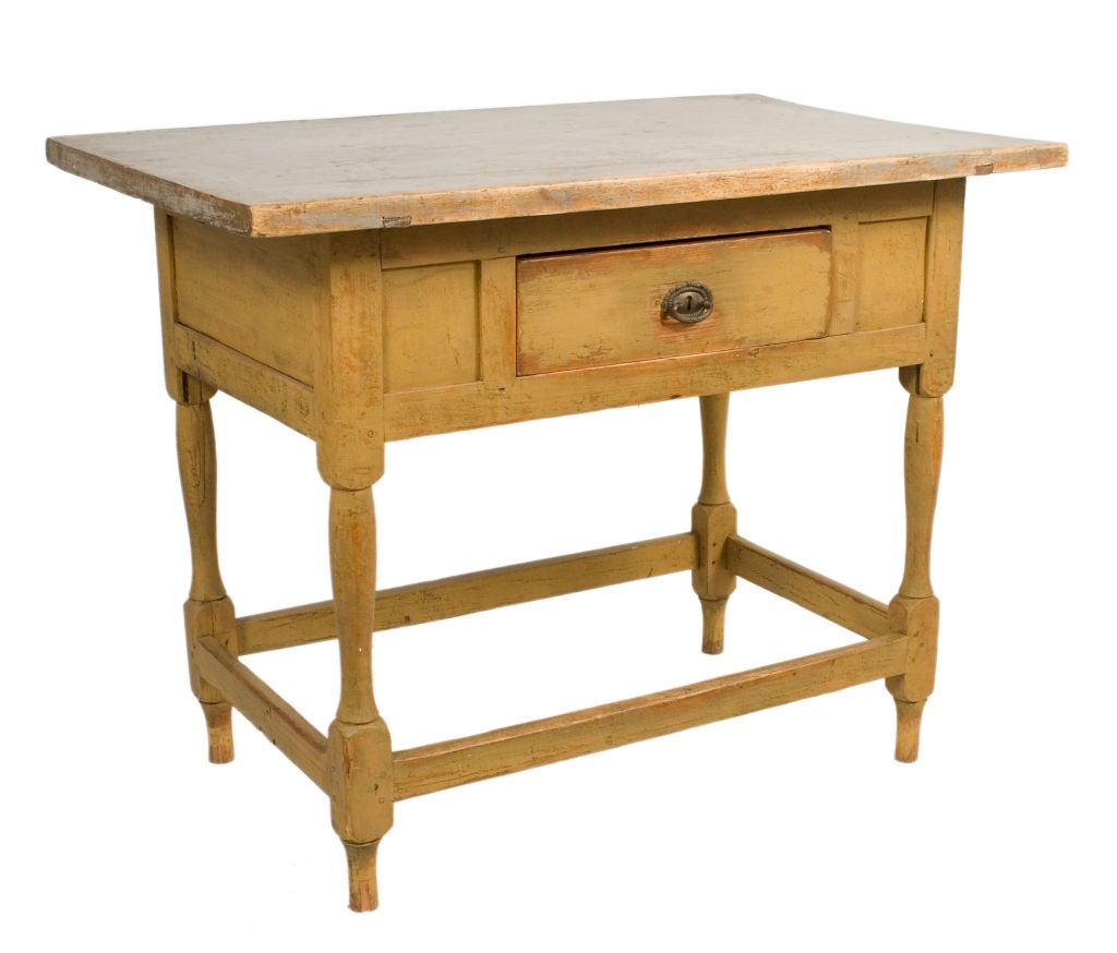 One drawer Baroque Table with a yellow ochre base and grey top.
