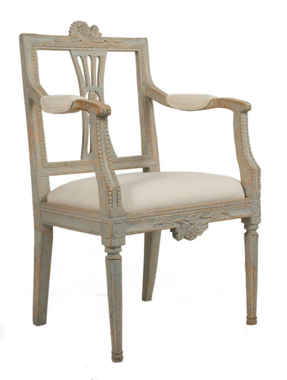 Pair of open back Gustavian Armchairs with grape motifs in a pale blue patina.