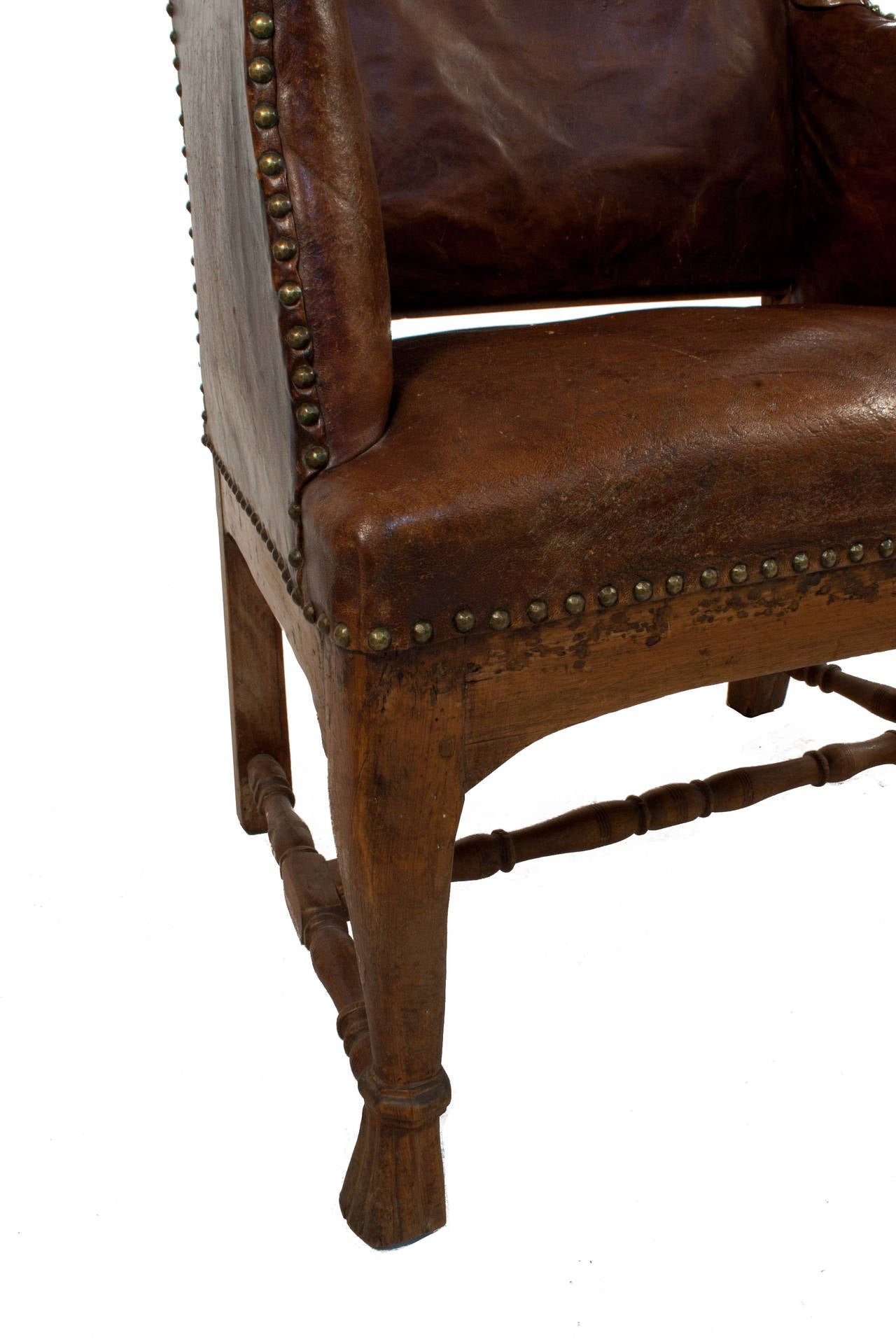 Baroque wingback chair in leather.