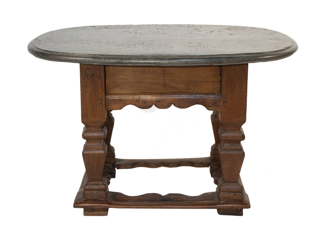 Baroque oval stone-top table. In all our years of collecting we've only come across one other oval stone-top table.