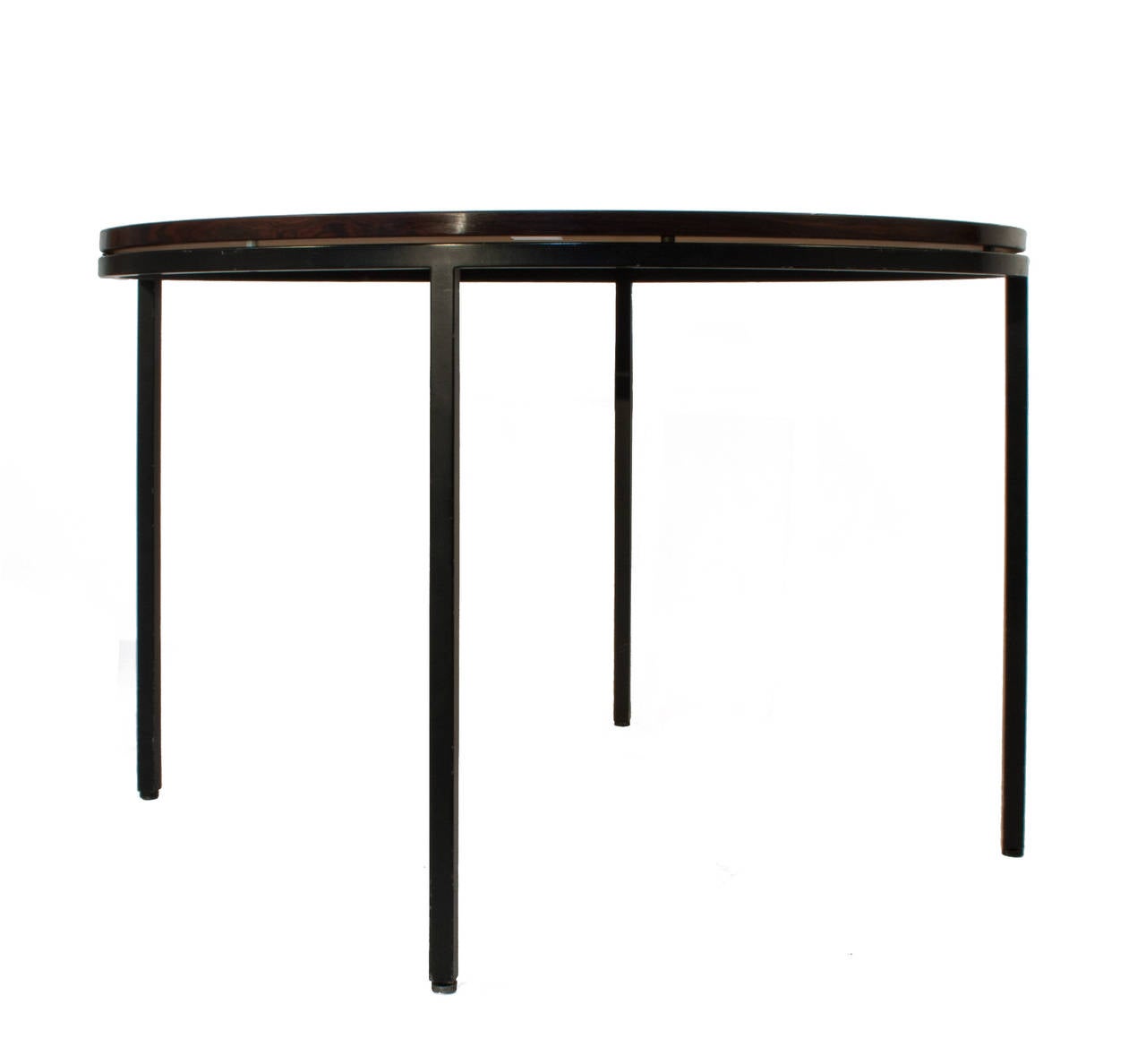 Round dining table with rosewood top on a black metal base by Mogens Koch.