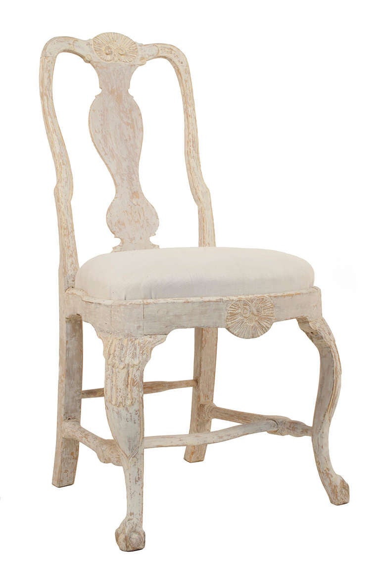 Set of 8 Rococo Side Chairs in a worn pale grey patina.