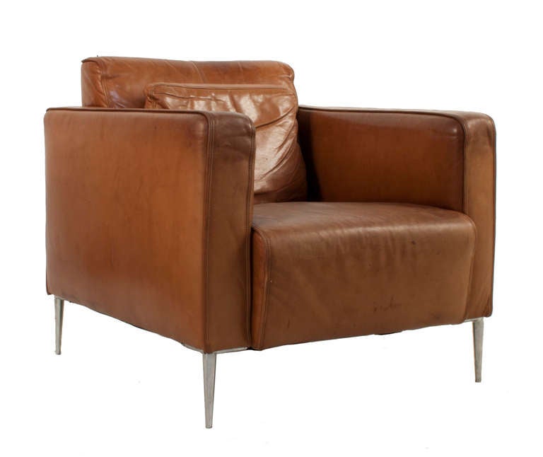 Pair of leather Lounge Chairs with steel feet.