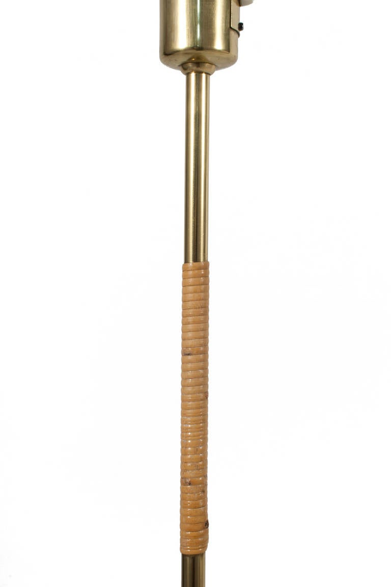 Brass and cane floor lamp by Gunilla Jung.