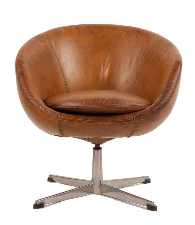 Set of four leather and chrome Swivel Chairs.