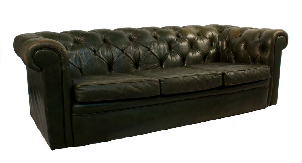 Three seat dark green leather Chesterfield Sofa.