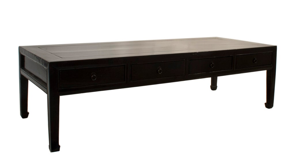 Black lacquered Coffee Table with four drawers.