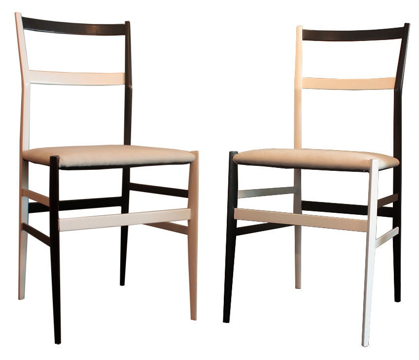 GIO PONTI (1891 - 1979)<br />
<br />
Very rare set of six black & white Superleggera chairs, circa 1957.<br />
<br />
Black & white lacquered, beechwood frames with neutral, sand colored fabric upholstered seats.<br />
<br />
H: 32