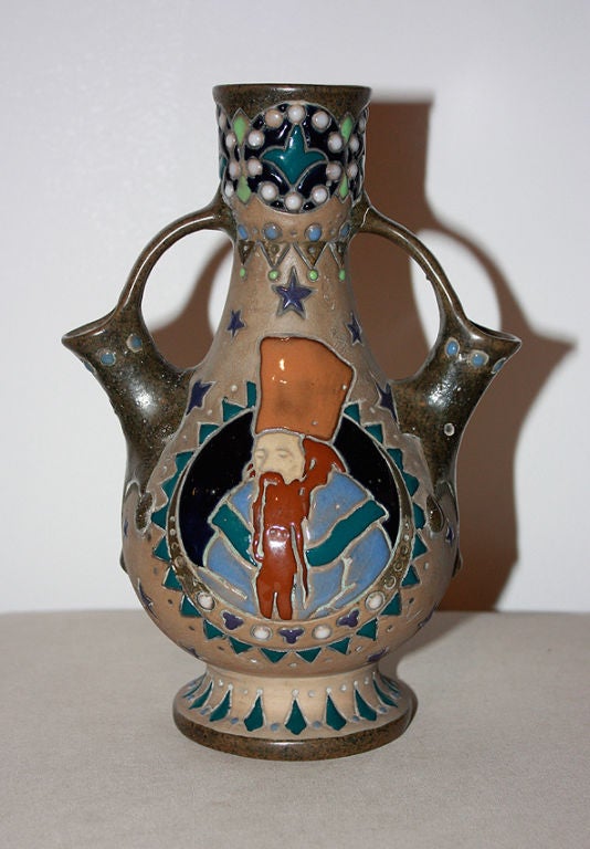 Rare vase in enamel ceramic with a motif of a Russian dignitary.<br />
Inspired by the works Ivan Bilibin.<br />
Many of this dignitary or tzar are Illustrated in the poems from Alexander Sergeyevich Pushkin.<br />
Stamped with two-headed eagle