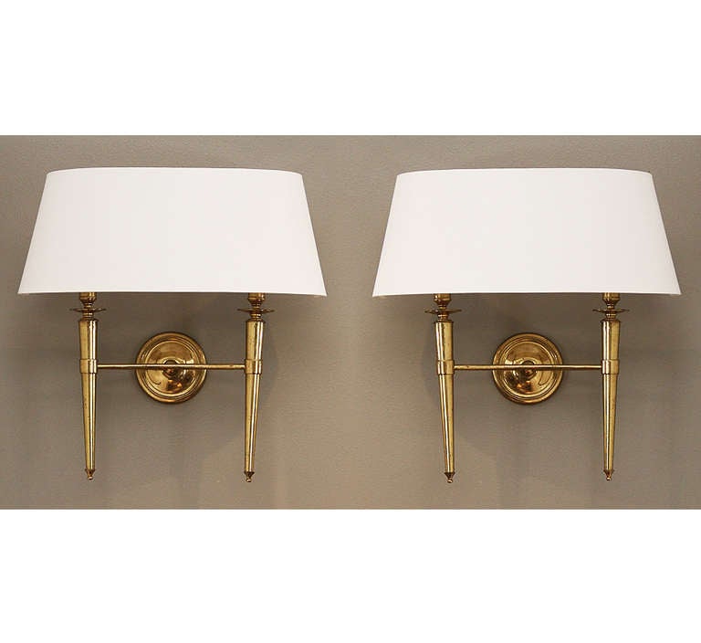 This elegant set of brass sconces comes from a set of 70 sconces we acquired from the Prince de Galles Hotel in Paris.

The sconce bodies are all in their original condition from 1940 and each have varying degrees of natural patina. We have had