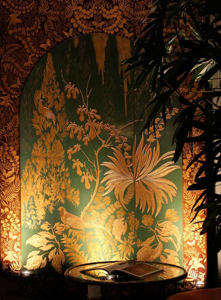 ARMAND-ALBERT RATEAU (1882-1938): Lacquered Panel - Museum Quality - One-of-a-kind

Exceptional panel depicting a luxuriant forest with birds of paradise and flights of butterflies incised and lacquered in matte and glossy gold on a jade green and