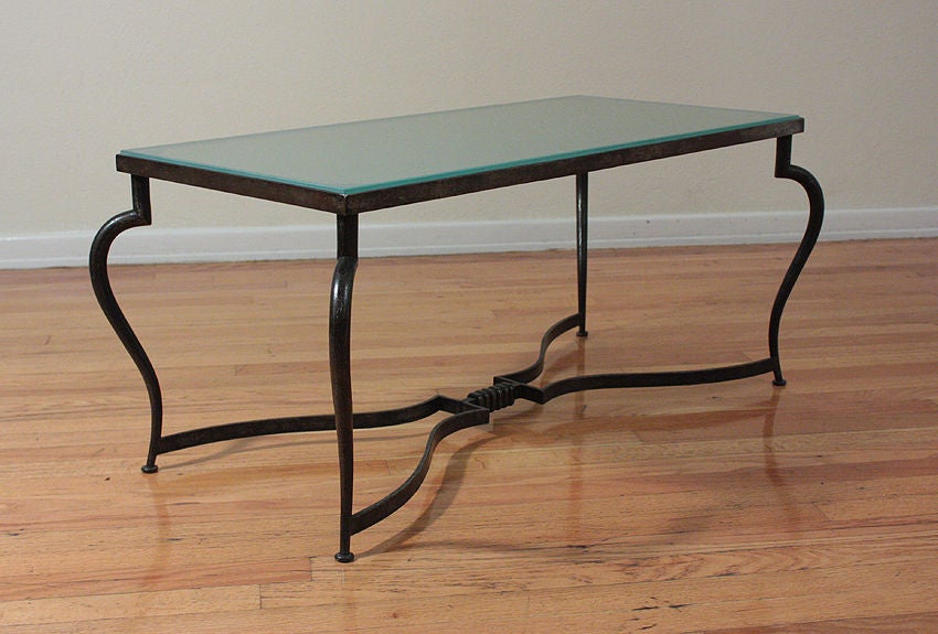 Michel ZADOUNAISKY (1903 - 1983)<br />
<br />
Very rare 1930 Art Deco patinated wrought iron table with a frosted glass top.<br />
<br />
An elegant and sophisticated model for a coffee table providing delicateness, simplicity, and class to any