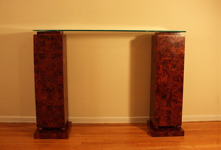 Important Art Deco Style Console From Cartier, 1970

Oak and amboyna burl veneer with a curved glass top.

This console can be used as two separate beautiful pedestals to enhance and display a sculpture, vase or lamp.

It comes from the French