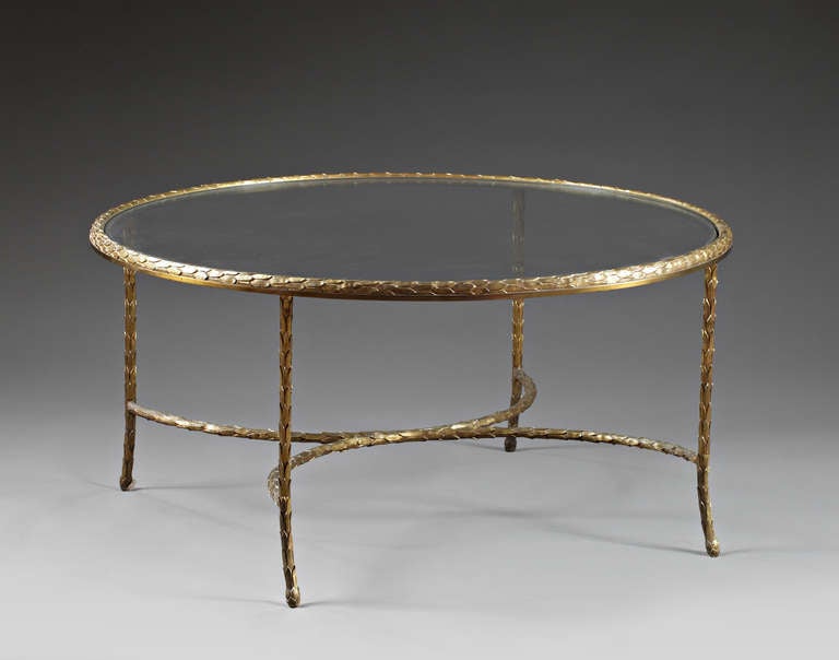 This elegant and extremely rare coffee table by Charles & Fils has a gilt bronze frame and a glass top. The frame has an exquisite tapered design, and each leg features a slight curving to the floor.

Frame is in original condition, with natural