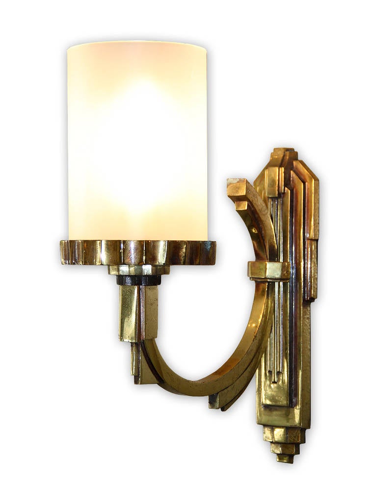 Maison Petitot, one single gilt bronze sconce with a tubular frosted glass lampshade, France, circa 1930. This sconce comes from a set of four, three has been sold and one is available now. Measurements: Height: 12