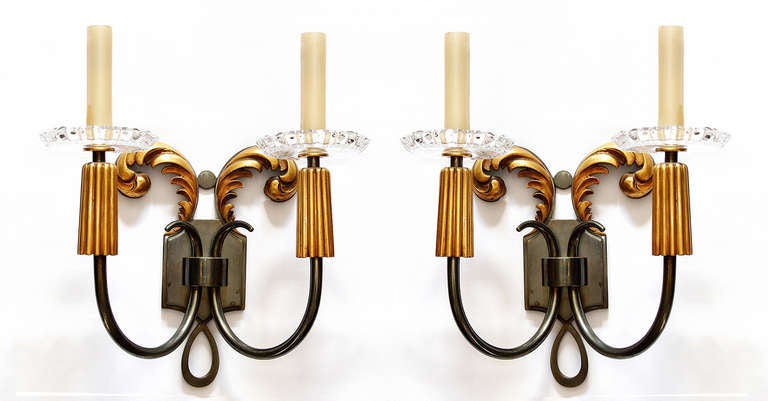 Elegant pair of 1940s era French sconces in cast bronze and glass.
Amazing fabrication and detail. Rare to find sconces of this quality.