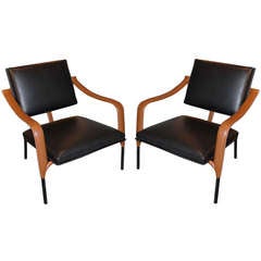 Jacques Adnet, Pair of leather lounge chairs