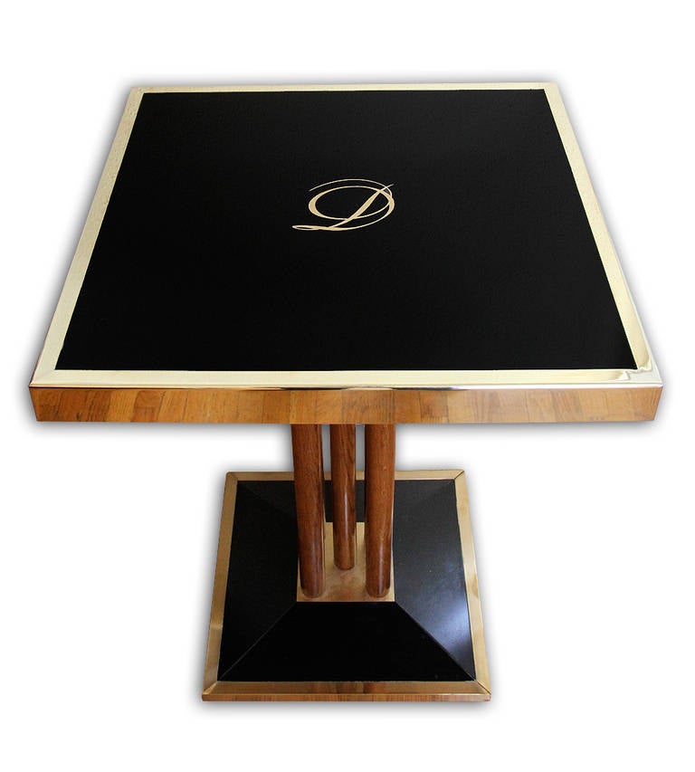 Very beautiful pair of bistro (bistrot) tables coming from the French restaurant, Drouant in Paris.
This square table is composed of a black glass framed in brass and mounted on a black base, which is also framed in brass.
The glass is new and it