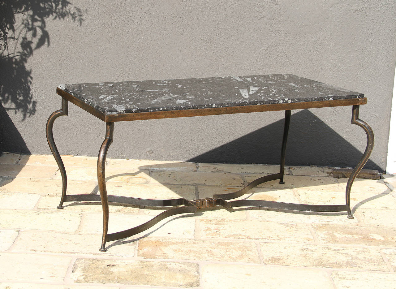 Michel Zadounaisky (1903 - 1983)

Very rare pair of 1930 Art Deco patinated wrought iron tables with a black fossils marble top.

An elegant and sophisticated model for a coffee table providing delicateness, simplicity, and class to any interior