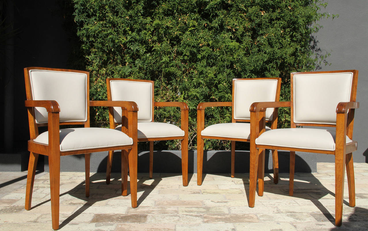 Four beautiful 1940s era French Art Deco armchairs.
This set comes a set of nine, we sold one as a desk chair and an additional pair not refinished yet.

This set of four 1940 beech wood Art Deco armchairs has been beautifully refinished with a