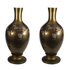 Elegant eglomise black and gold lamps with woven floral motif