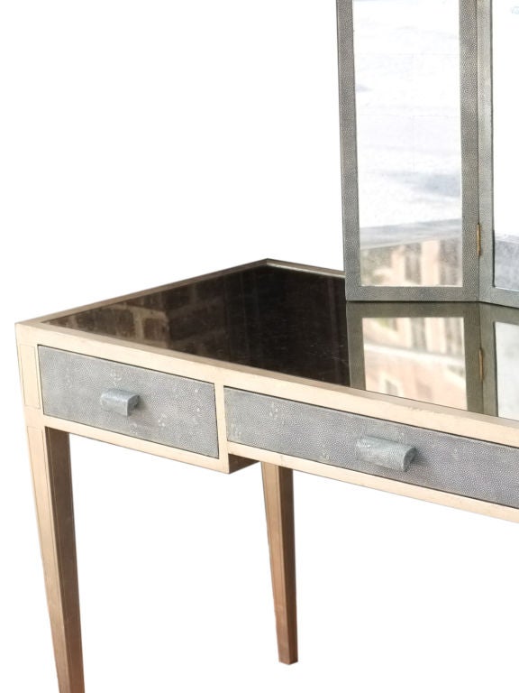 A wonderful three draw shagreen and silver leaf desk/vanity with shagreen and silver leaf mirror and bench