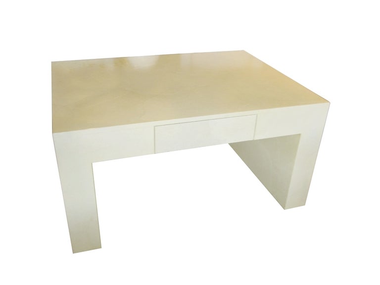 The lustrous parchment covering is all the decoration needed to give this table a subtle, warm intrigue. Perfect for displaying a treasured family heirloom, vase of flowers, or lamp.
The table is thick and very substantial in size and will be the