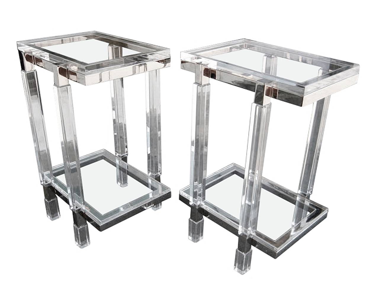 Beautiful set of tall side tables or pedestals in Lucite and nickel by Charles Hollis Jones.

Each table weights about 40 pounds, the metal pieces are made out of 1 1/4