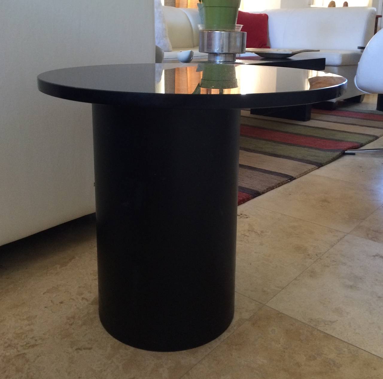 This stunning set of side tables are a must have for any interior.
The bases of the tables are extremely well made, they are solid steel with a chrome ring on the top, each pedestal weights about 50 pounds, the to is 1