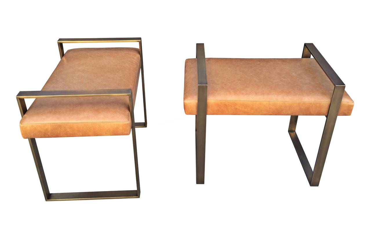 Pair of solid brass benches designed by Charles Hollis Jones in the 1970s and manufactured in 2015.

The frames of the benches are made in solid brass and upholstered in COM or COL, the pair shown were made for a client in San Francisco and they