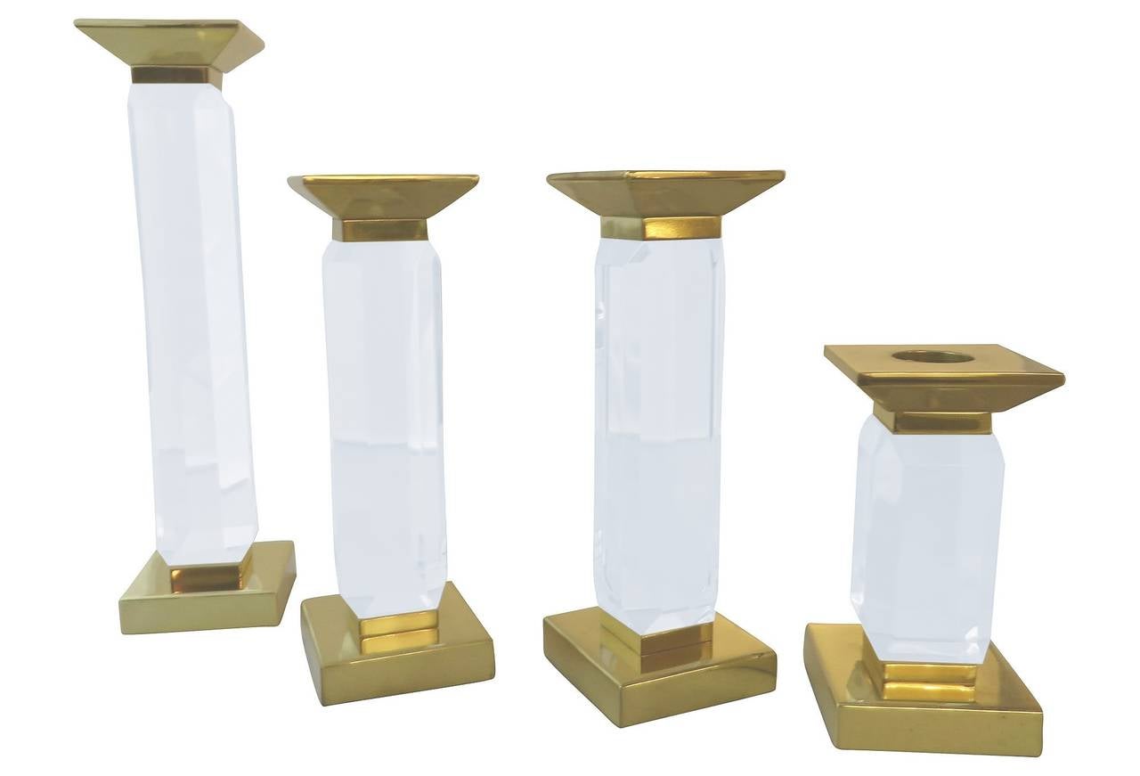 Beautiful set of four of candleholders designed by Charles Hollis Jones in Lucite and brass.
The pieces are part of the 