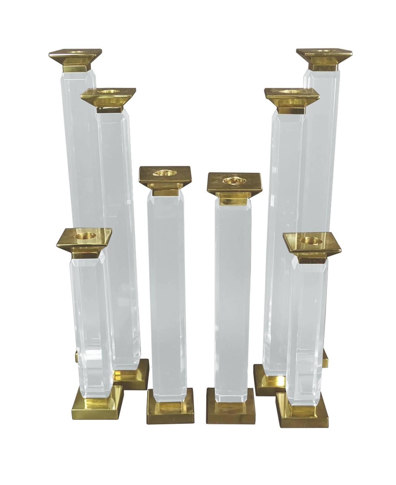 Beautiful set of three of candleholders designed by Charles Hollis Jones in Lucite and solid brass.
The pieces are part of the 